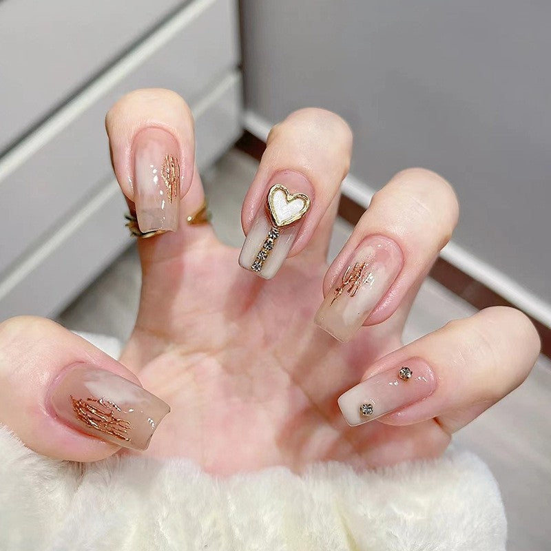 Golden Embrace Medium Square Sheer Pink Press On Nail Set with Gold Foil Wings and Heart Charm Accents