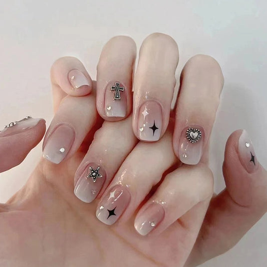 Nails with decorative designs on a light background
