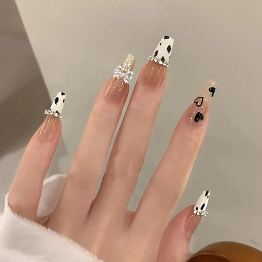 Musical Notes Long Coffin Beige Press On Nail Set with Black and White Dalmatian Pattern and Rhinestone Embellishments