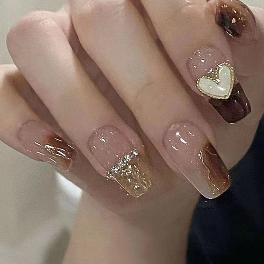 Golden Heartbeat Medium Coffin Mocha Press On Nail Set with Gold Glitter Drips and Cream Heart Accent