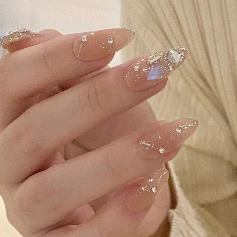 Elegant Medium Almond Beige Press On Nails with Glitter Accents and Large Gemstone Features