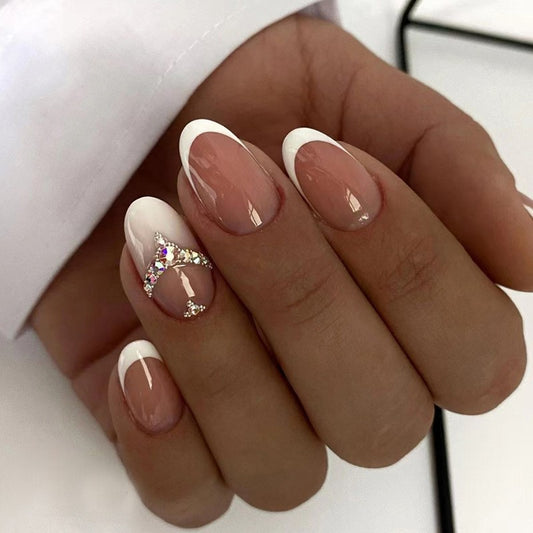 Close-up of a hand with stylish nail design on a white background